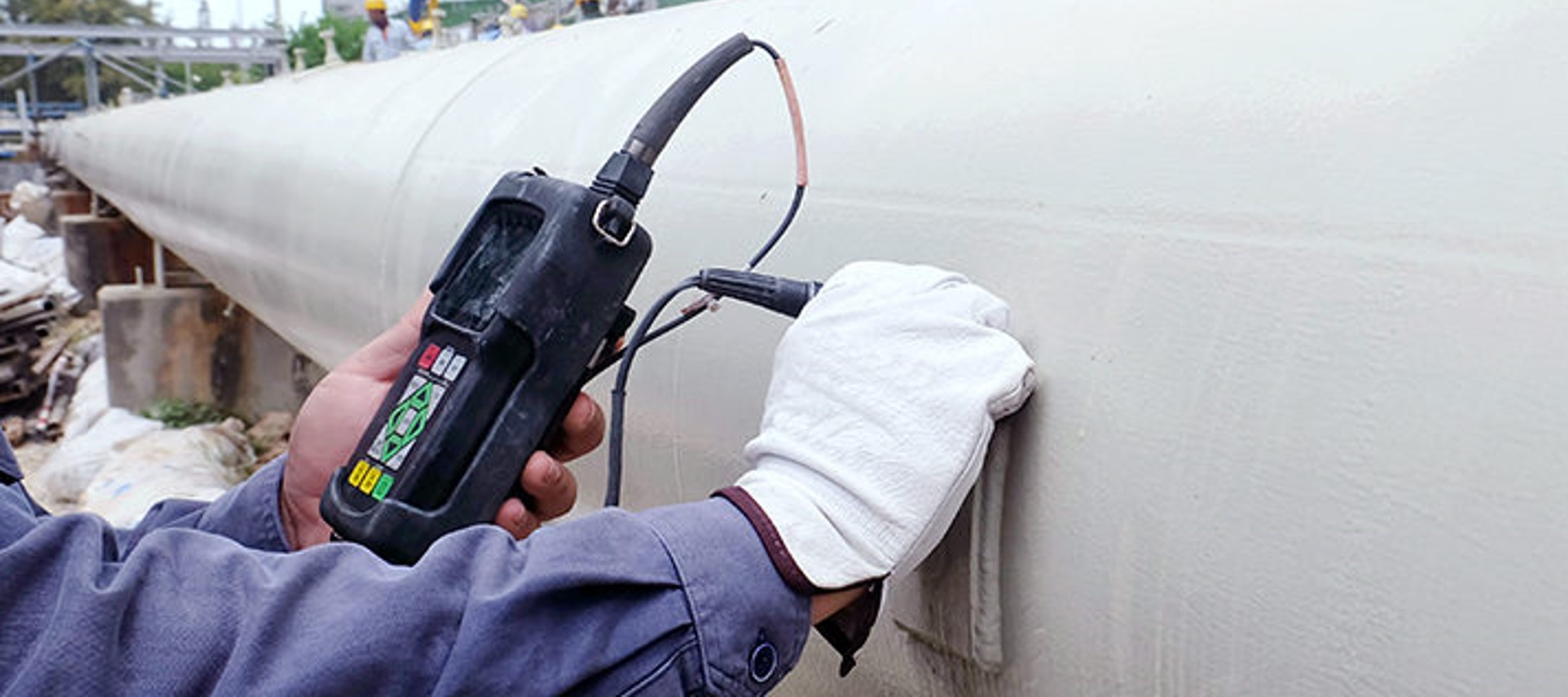 hand and monitoring device inspecting used equipment